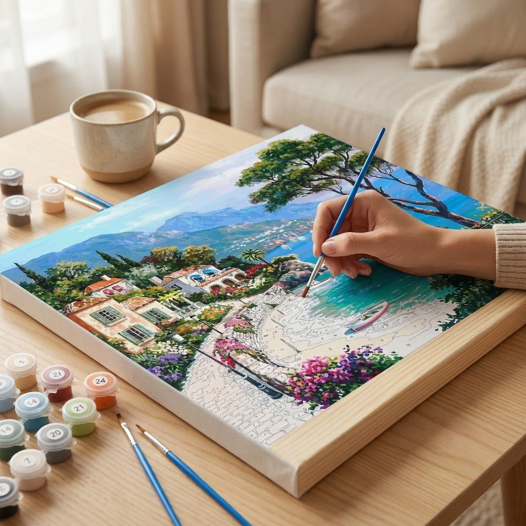 Persona pintando el lienzo por numeros ARTELIA sobre una mesa de madera