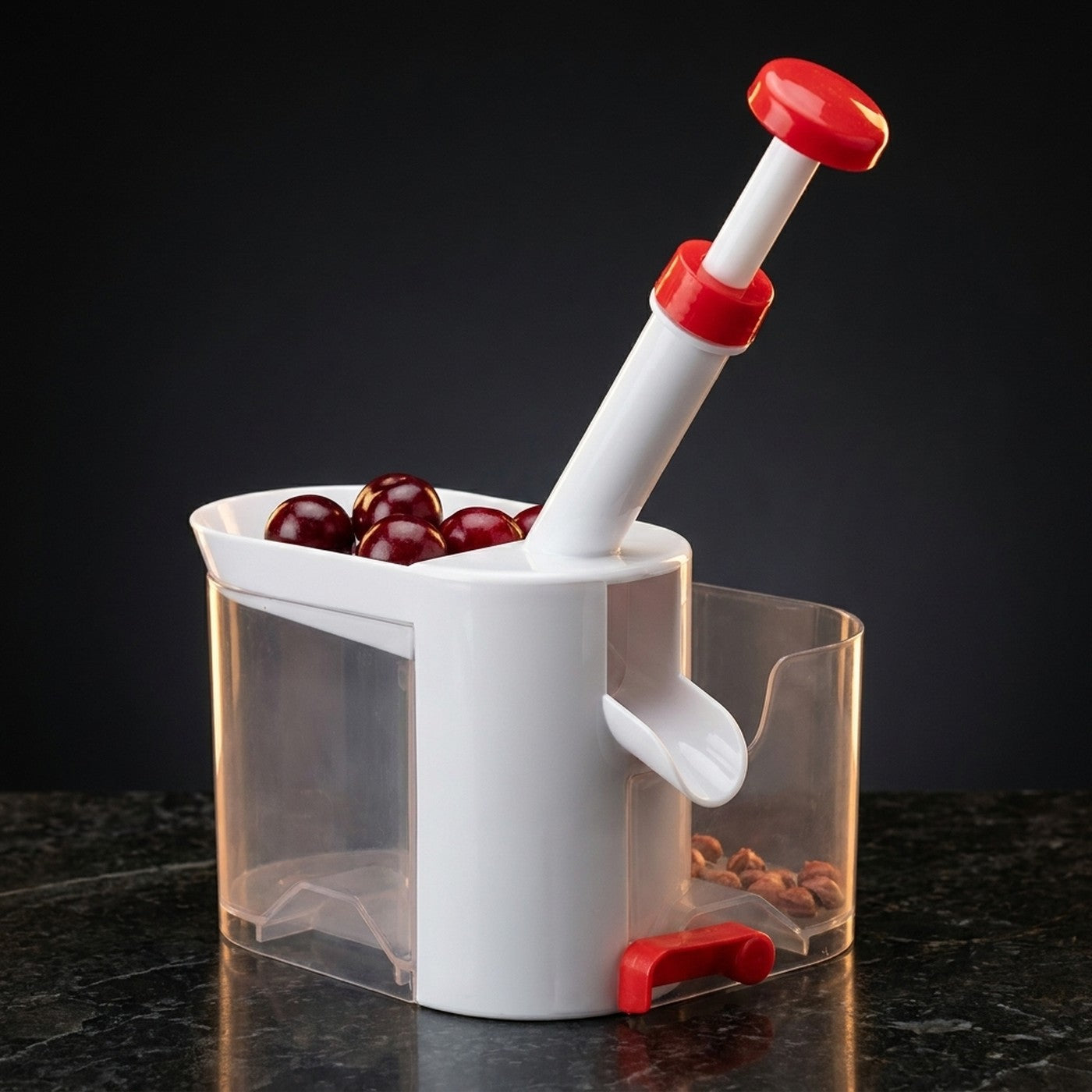 Maquina deshuesadora de cerezas manual, blanca con rojo